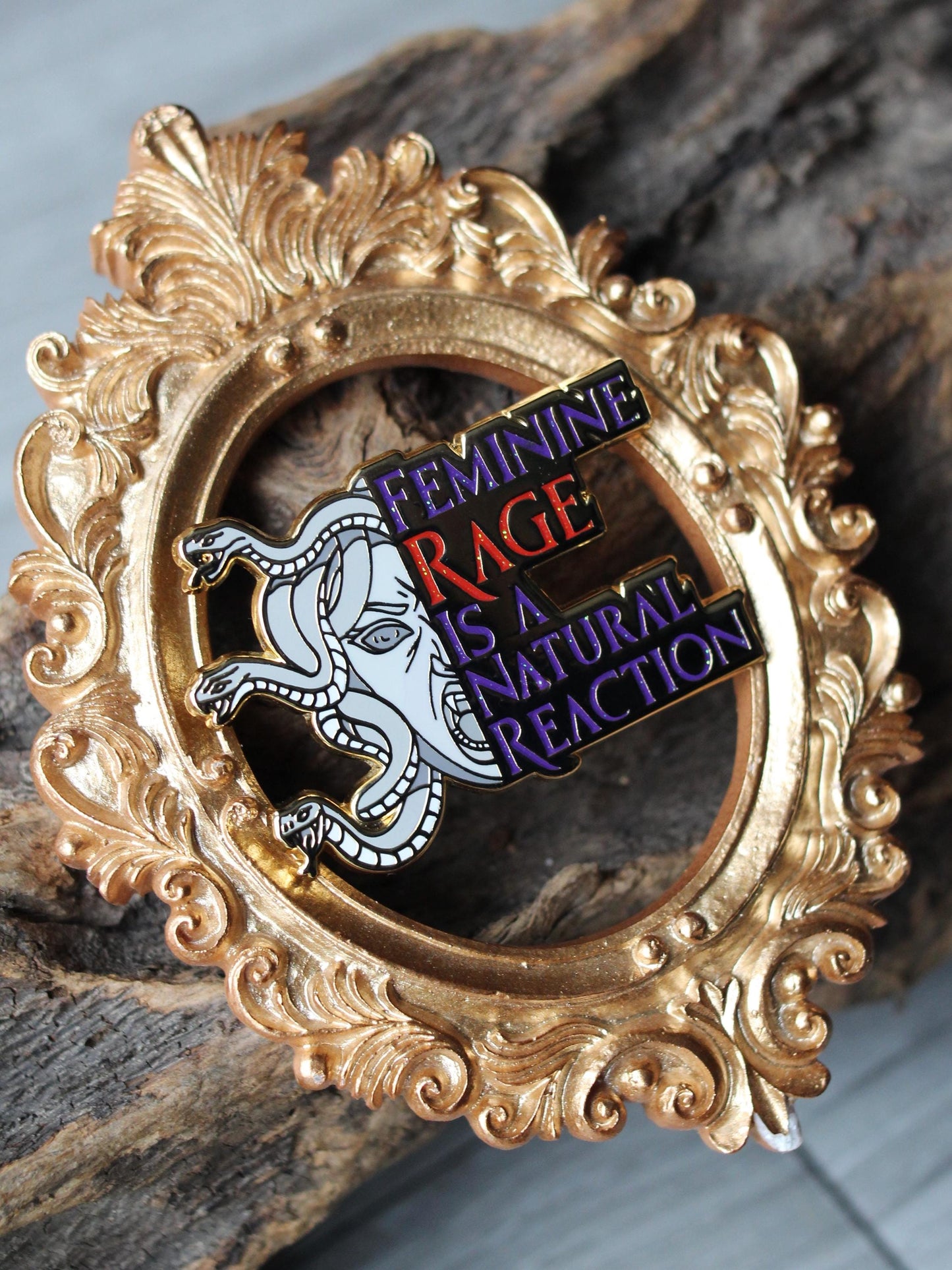 Feminine rage is a natural reaction enamel pin