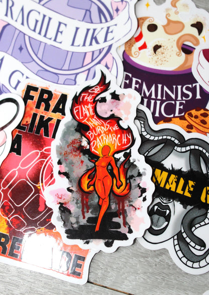 be the flame that burns the patriarchy feminine rage translucent sticker