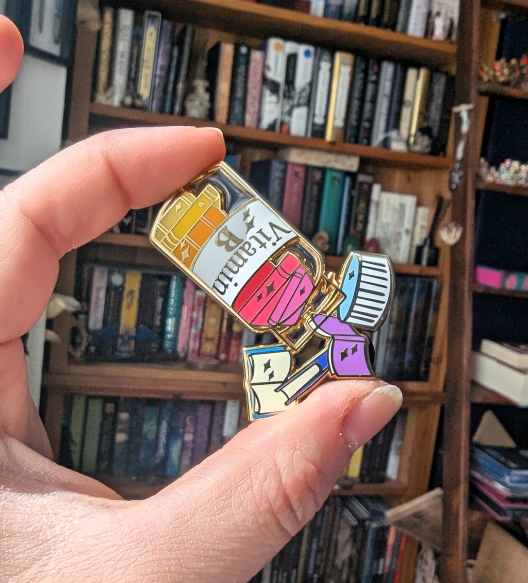 vitamin book enamel pin