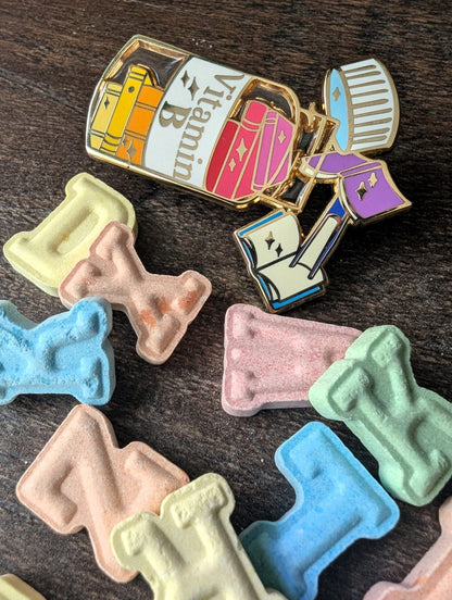 vitamin book enamel pin