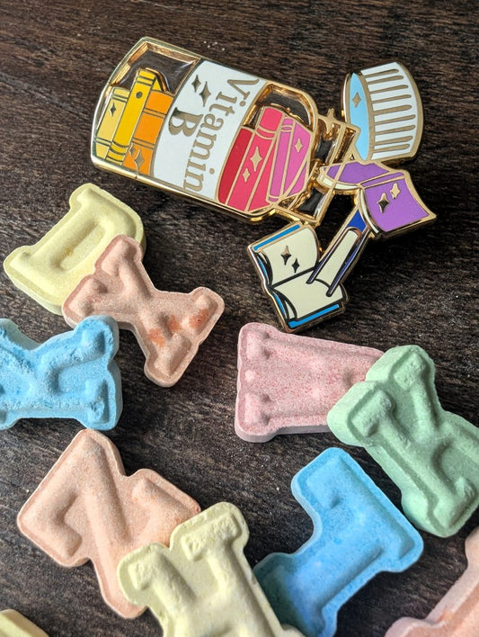 vitamin book enamel pin