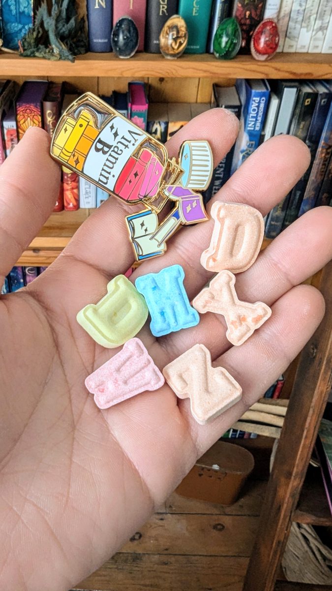 vitamin book enamel pin