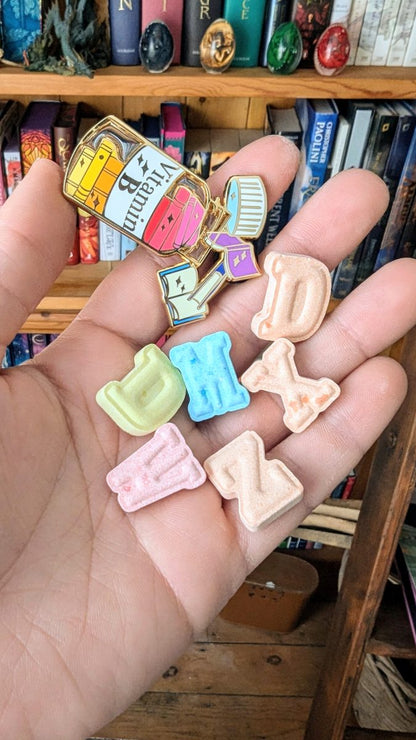 vitamin book enamel pin