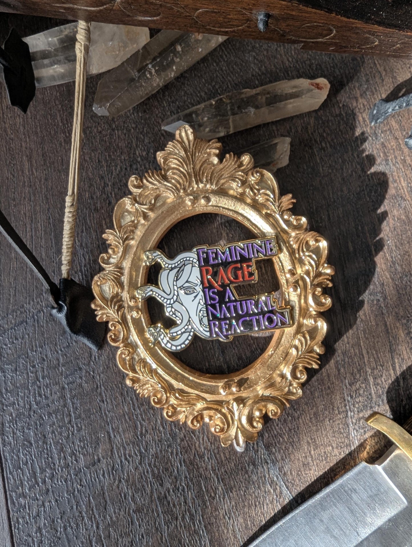 Feminine rage is a natural reaction enamel pin