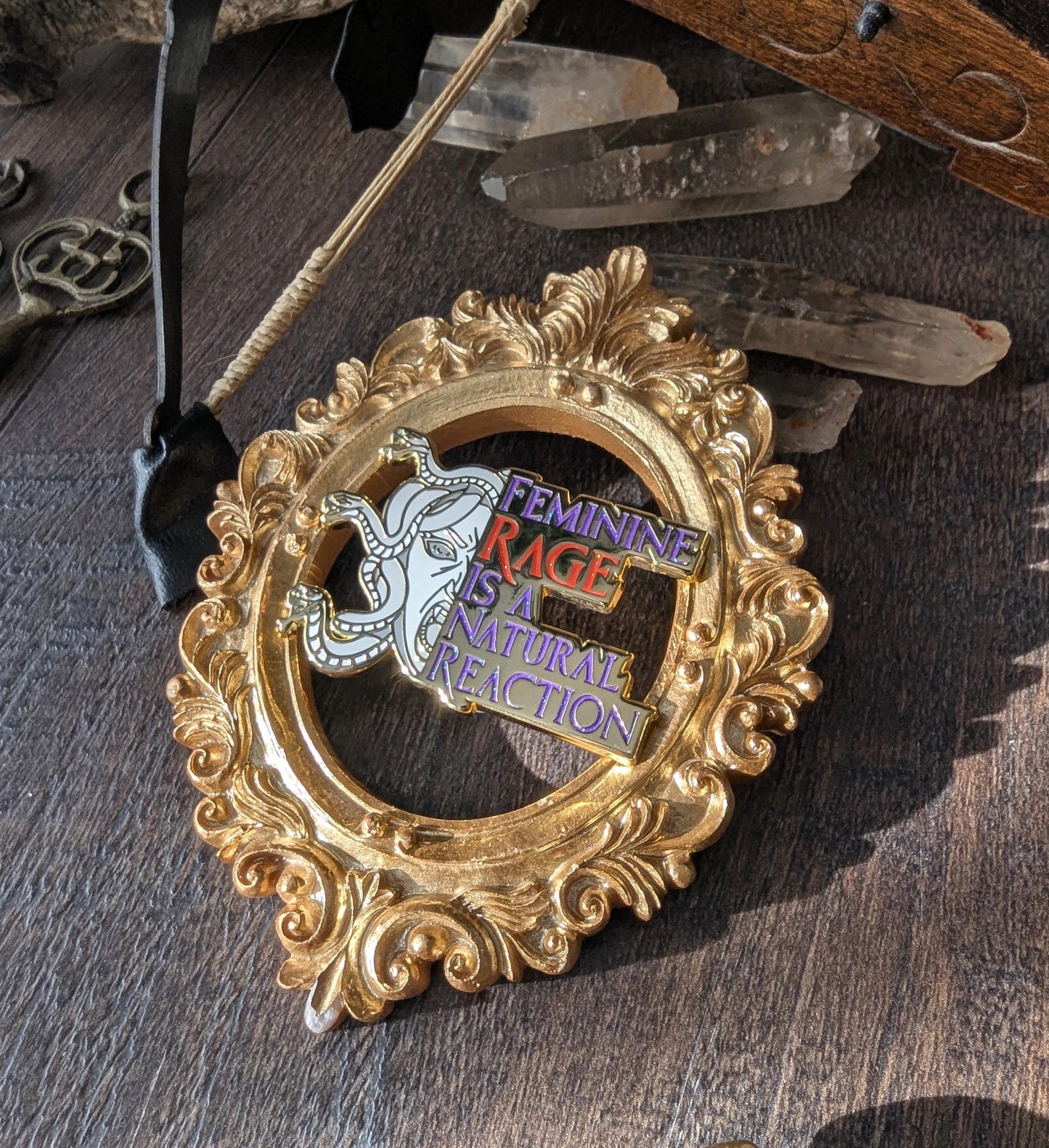 Feminine rage is a natural reaction enamel pin