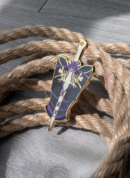 The Blade Shibari enamel pin, rope label badge