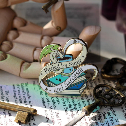 Smut and Sarcasm bookish enamel pin, book lover badge