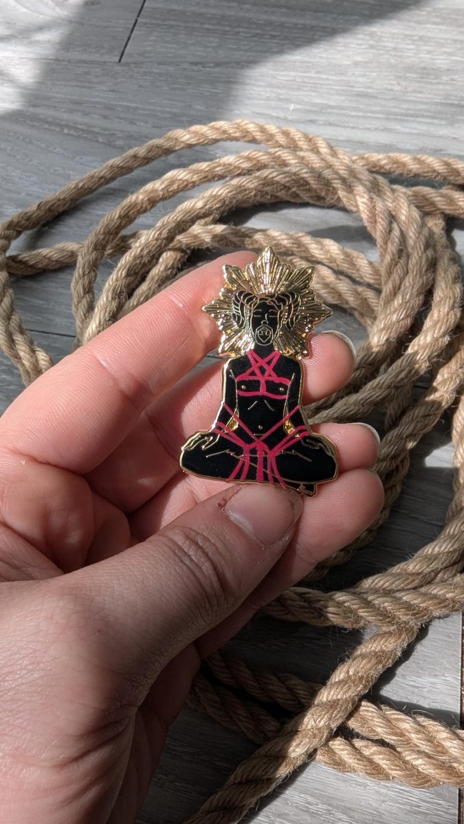 the Summoning Shibari enamel pin, rope label badge